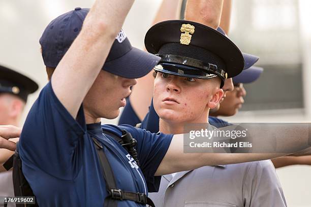 An incoming Citadel freshman known as knob stands in formation as an upperclassman issues orders at The Citadel, The Military College of South...