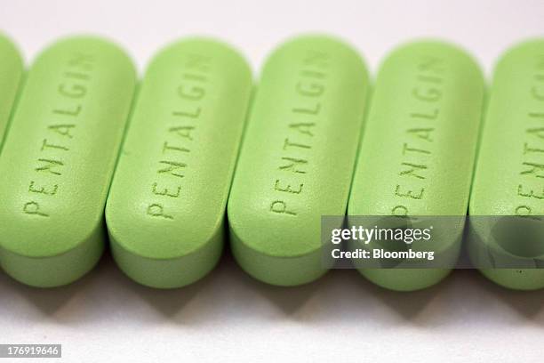 Pentalgin tablets sit after manufacture at OAO Pharmstandard's Leksredstva drug unit in Kursk, Russia, on Friday, Aug. 16, 2013. Pharmstandard said...