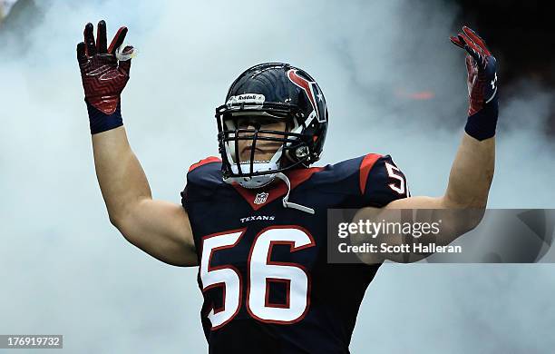 Brian Cushing of the Houston Texans enters the field before the start of the preseason game against the Miami Dolphins at Reliant Stadium on August...