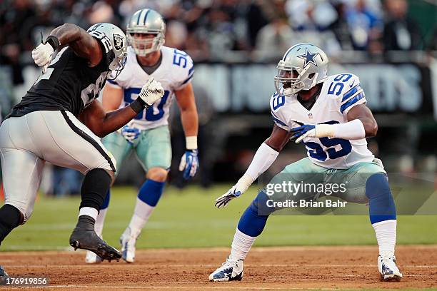 Linebacker Ernie Sims of the Dallas Cowboys drops back against tight end Richard Gordon of the Oakland Raiders in the first quarter of a preseason...