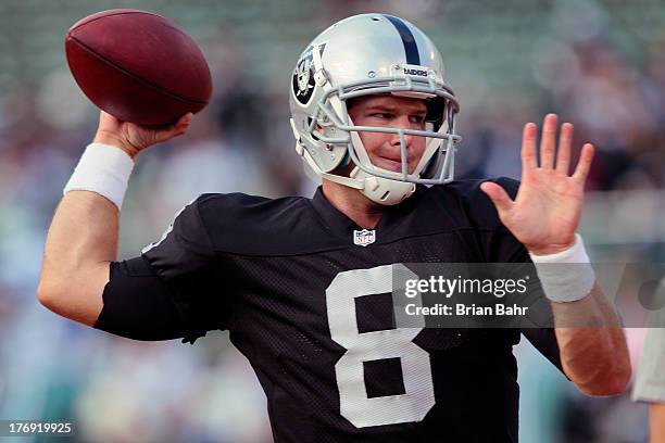 Quarterback Tyler Wilson of the Oakland Raiders warms up before a preseason game against the Dallas Cowboys on August 9, 2013 at O.co Coliseum in...