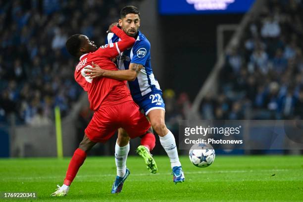 Abdullahi Alhassan Yusuf midfielder of Antwerp FC battles for the ball with Joao Mario forward of Porto during the UEFA Champions League group H...