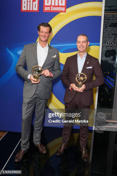 Dr.-Ing. Stefan Floeck and Franciscus Van Meel attend the "Das Goldene Lenkrad" Award 2023 at Axel Springer Haus on November 7, 2023 in Berlin,...