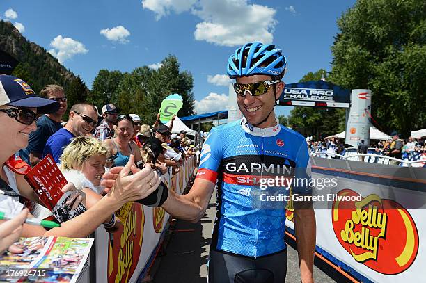 Christian Vande Velde of the United States riding for Team Garmin Sharp greets fans prior to the start of Stage One of the USA Pro Cycling Challenge...