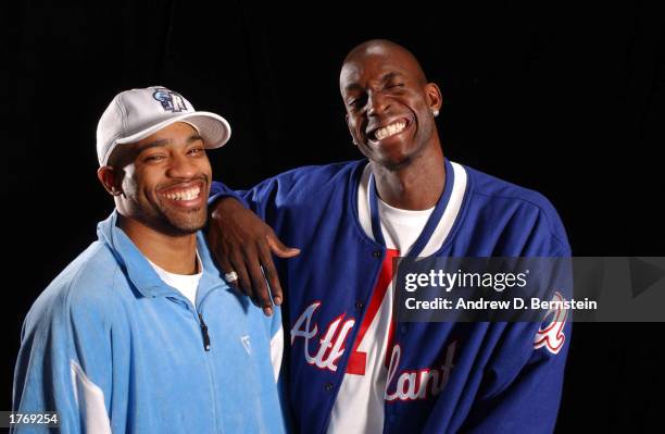Vince Carter of the Toronto Raptors and Kevin Garnett of the Minnesota Tiberwolves pose for a media day portrait during the 2003 NBA All-Star weekend...