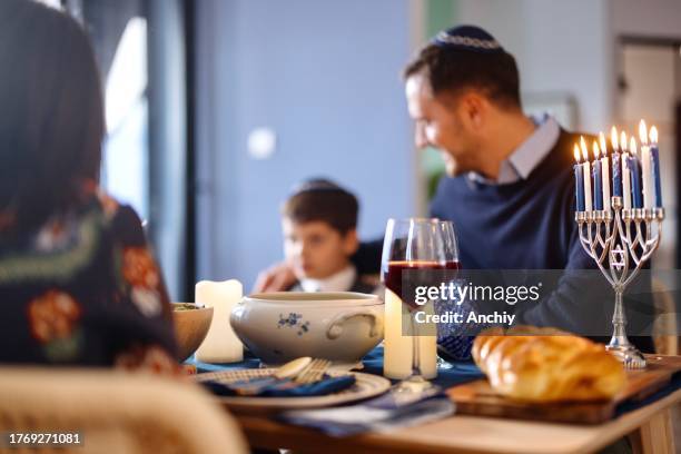 close-up picture of a dining table during hanukkah - matzah stock pictures, royalty-free photos & images