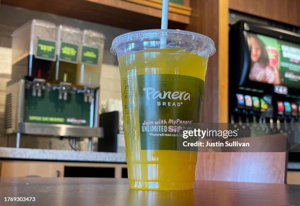 In this photo illustration, a Panera Bread mango yuzu citrus charged lemonade is displayed at a Panera Bread restaurant on November 01, 2023 in...