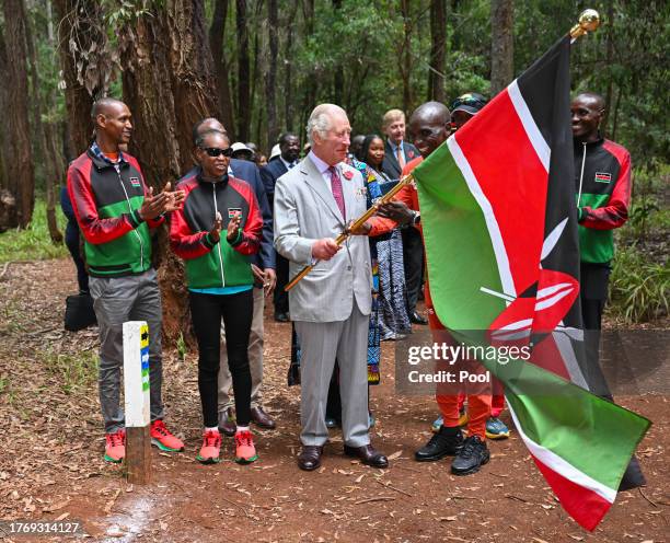 King Charles III with Kenyan marathon runner Eliud Kipchoge, as they flag off to start a 15km "Run for Nature" event during a visit to Karura urban...