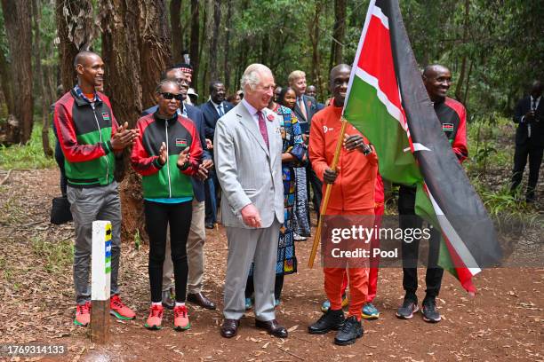 King Charles III with Kenyan marathon runner Eliud Kipchoge, as they flag off to start a 15km "Run for Nature" event during a visit to Karura urban...