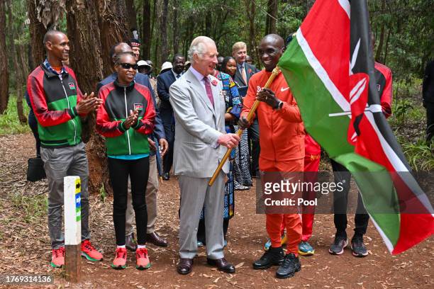 King Charles III with Kenyan marathon runner Eliud Kipchoge, as they flag off to start a 15km "Run for Nature" event during a visit to Karura urban...