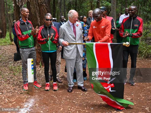 King Charles III with Kenyan marathon runner Eliud Kipchoge, as they flag off to start a 15km "Run for Nature" event during a visit to Karura urban...