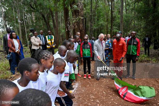 King Charles III with Kenyan marathon runner Eliud Kipchoge, as they flag off to start a 15km "Run for Nature" event during a visit to Karura urban...