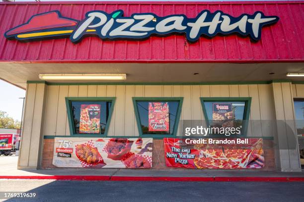 Pizza Hut store is seen on November 01, 2023 in Austin, Texas. Pizza Hut's third-quarter revenue fell short of analysts' expectations for same-store...