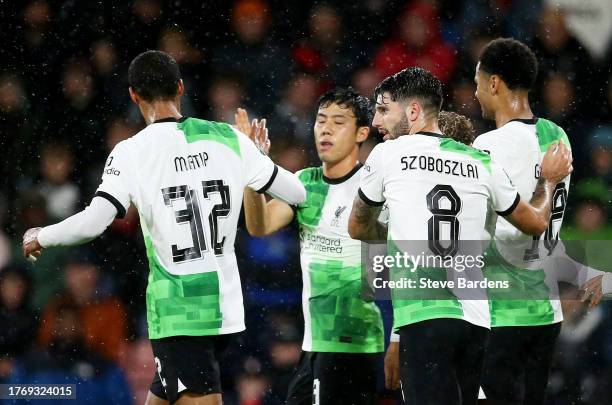 Cody Gakpo of Liverpool celebrates with teammates after scoring the team's first goal during the Carabao Cup Fourth Round match between AFC...