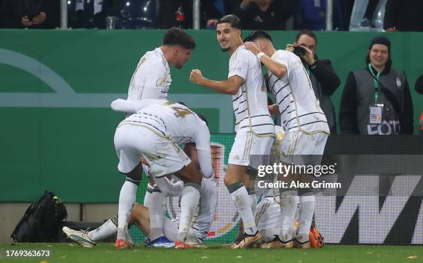 Patrick Sontheimer of FC Saarbrücken celebrates with teammates after scoring the team's first goal during the DFB cup second round match between 1....