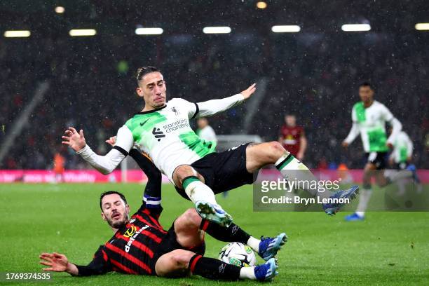 Kostas Tsimikas of Liverpool is tackled by Adam Smith of AFC Bournemouth during the Carabao Cup Fourth Round match between AFC Bournemouth and...