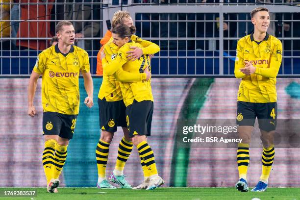 Julian Brandt of Borussia Dortmund celebrates after scoring the team's second goal with Julian Ryerson of Borussia Dortmund, Marcel Sabitzer of...