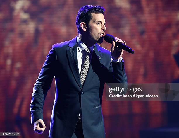 Singer/songwriter Chris Mann performs at the 2013 MDA Show Of Strength at CBS Studios on July 31, 2013 in Los Angeles, California.