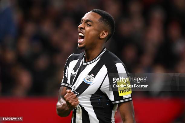 Joe Willock of Newcastle United celebrates after scoring their sides third goal during the Carabao Cup Fourth Round match between Manchester United...