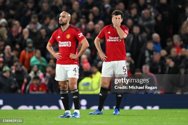 Harry Maguire of Manchester United looks dejected after Joe Willock of Newcastle United scores their sides third goal during the Carabao Cup Fourth...