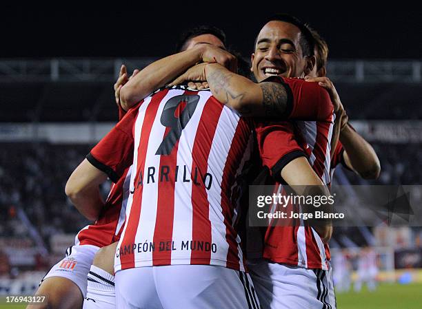 Guido Carrillo of Estudiantes de La Plata celebrates a goal with his teammates during a match between Lanus and Estudiantes de La Plata as part of...