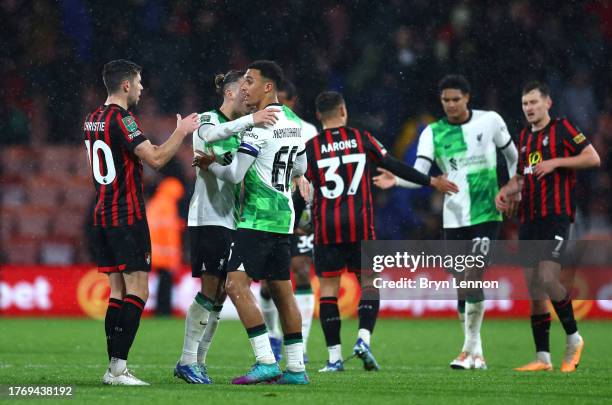 Kostas Tsimikas and Trent Alexander-Arnold of Liverpool celebrate victory at full-time following the Carabao Cup Fourth Round match between AFC...