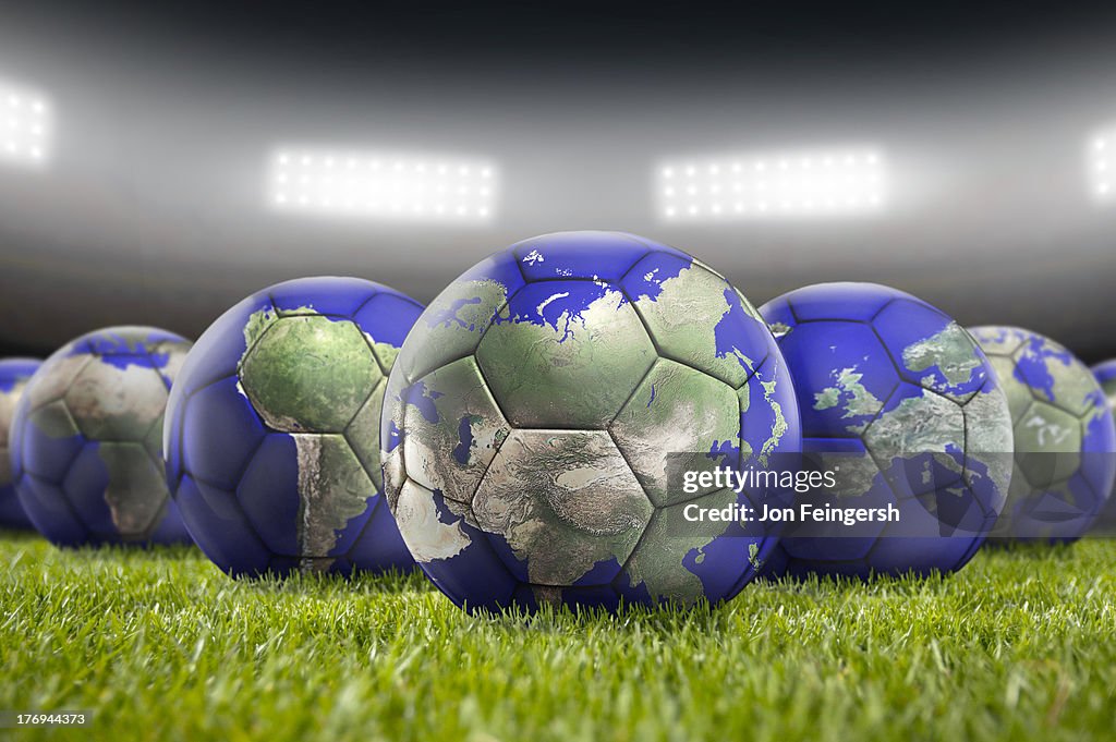 World Soccer Balls on Pitch