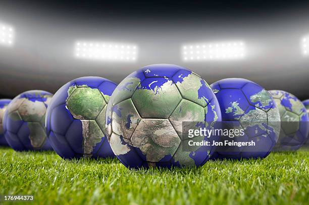 world soccer balls on pitch - coupe du monde de football photos et images de collection