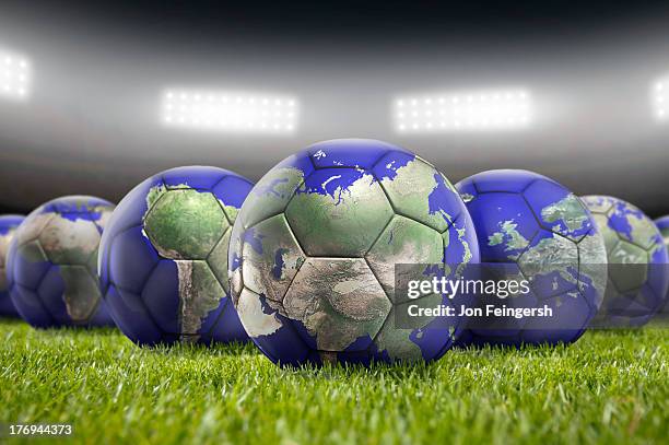 world soccer balls on pitch - international soccer event 個照片及圖片檔