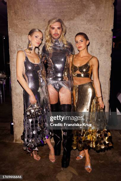 Leonie Hanne, Bill Kaulitz and Caro Daur attend the Rabanne X H&M Vogue Dinner at The Feuerle Collection on November 7, 2023 in Berlin, Germany.