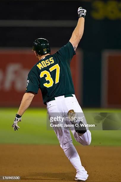 Brandon Moss of the Oakland Athletics celebrates after hitting a walk off home run against the Seattle Mariners during the ninth inning at O.co...