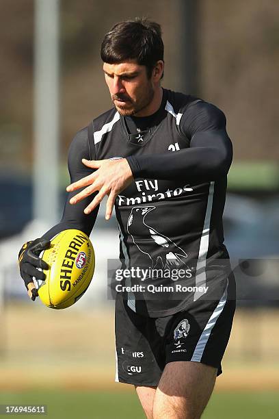 Quinten Lynch of the Magpies kicks during a Collingwood Magpies AFL training session at Olympic Park on August 20, 2013 in Melbourne, Australia.
