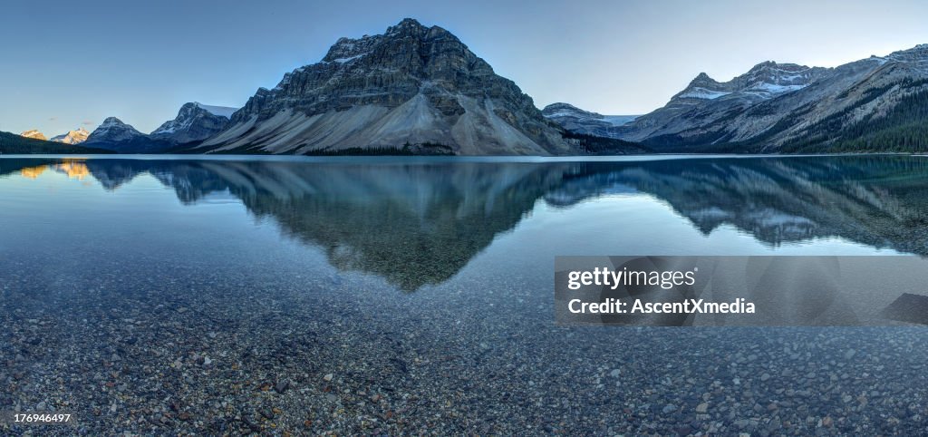 Reflection of mountains on tranquil lake surface