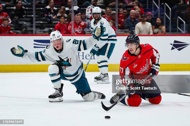 Fabian Zetterlund of the San Jose Sharks reacts after receiving a penalty for hooking against T.J. Oshie of the Washington Capitals during the second...