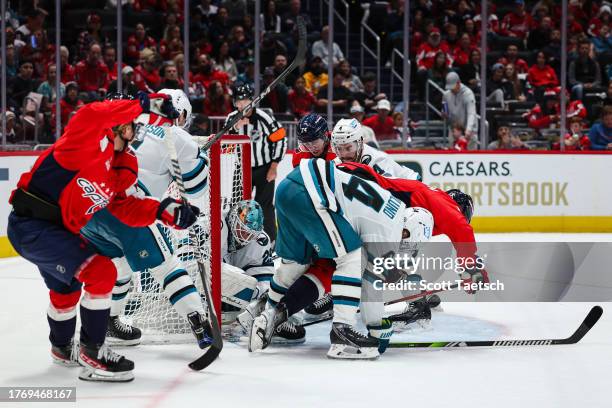 Mackenzie Blackwood of the San Jose Sharks makes a save in traffic during the second period of the game against the Washington Capitals at Capital...