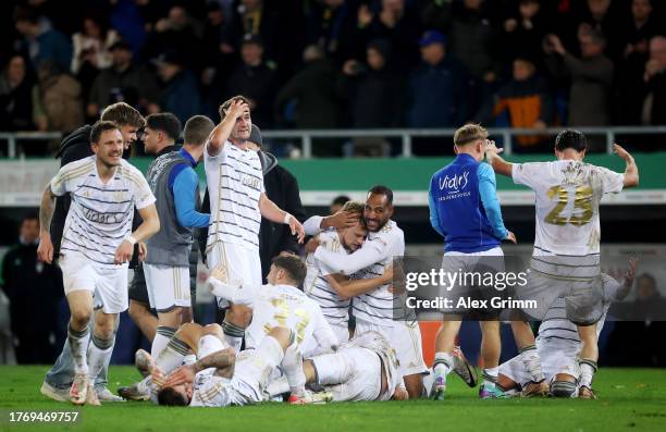 Saarbrücken players celebrate following the team's victory during the DFB cup second round match between 1. FC Saarbrücken and FC Bayern München at...