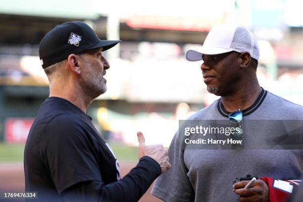 Manager Torey Lovullo of the Arizona Diamondbacks meets with former MLB player Ken Griffey Jr. Before Game Five of the World Series against the Texas...