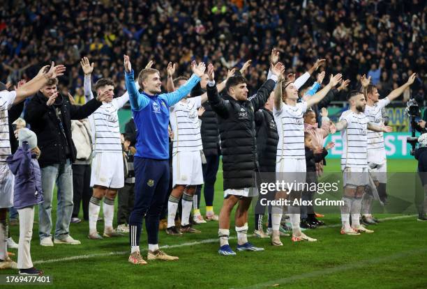 Saarbrücken players celebrate with the fans following the team's victory during the DFB cup second round match between 1. FC Saarbrücken and FC...