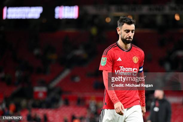 Bruno Fernandes of Manchester United looks dejected following the team's defeat during the Carabao Cup Fourth Round match between Manchester United...