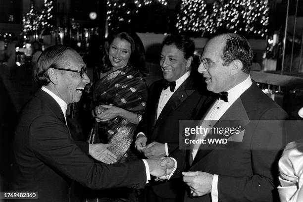 Pei, Nancy Kovack, Zubin Mehta, and Joseph E. Brooks attend an event at the flagship location of Lord & Taylor on November 28, 1984.