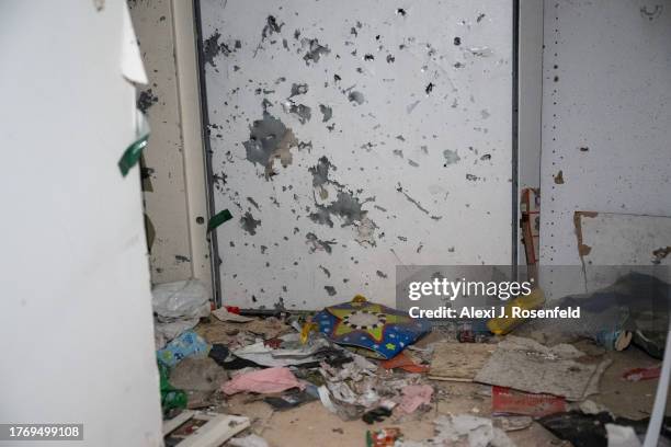 Damaged bomb shelter door and wall is seen after grenades were thrown inside of it during a Hamas attack on this kibbutz on Oct 7th near the border...