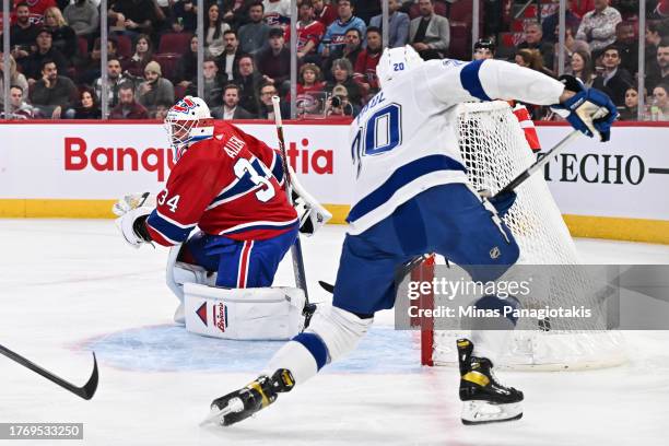 Nicholas Paul of the Tampa Bay Lightning scores on goaltender Jake Allen of the Montreal Canadiens during the first period at the Bell Centre on...