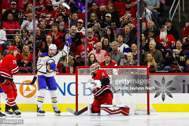Tyson Jost of the Buffalo Sabres celebrates Alex Tuch during the second period of the game against the Carolina Hurricanes at PNC Arena on November...