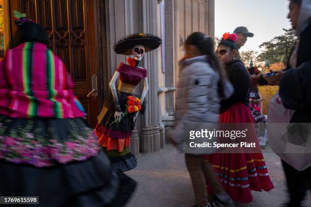 People visit the grounds of Greenwood Cemetery to celebrate Día de los Muertos in Brooklyn on November 01, 2023 in New York City. The holiday, which...