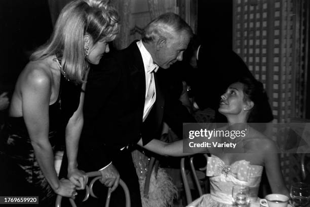 Alexis Maas, Johnny Carson, and Barbara Harris attend a party, celebrating the 56th Academy Awards, at the Bistro, a restaurant in Beverly Hills,...