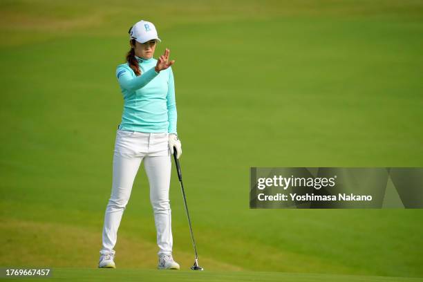 Mone Inami of Japan lines up a putt on the 1st green during the first round of the TOTO Japan Classic at the Taiheiyo Club's Minori Course on...