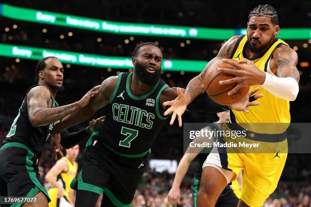 Jaylen Brown of the Boston Celtics and Obi Toppin of the Indiana Pacers battle for control of the ball during the second quarter at TD Garden on...