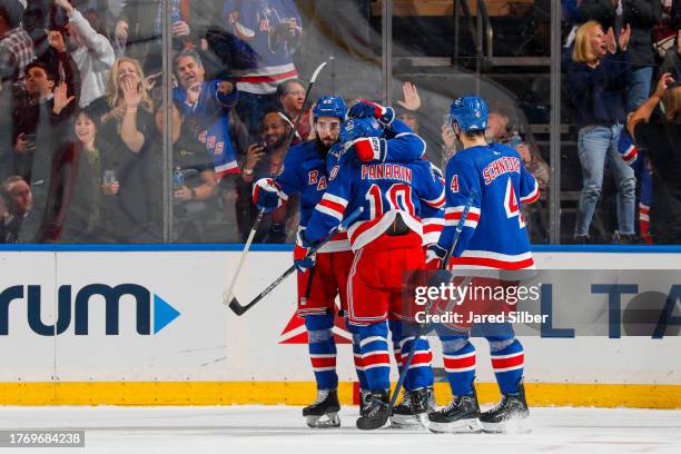 Artemi Panarin of the New York Rangers celebrates with teammates after scoring a goal in the second period against the Detroit Red Wings at Madison...
