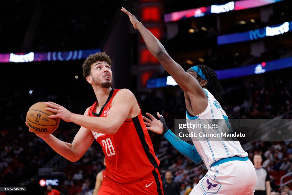 Hornets Rockets 2002 Alperen Sengun of the Houston Rockets controls the ball ahead of Mark ...