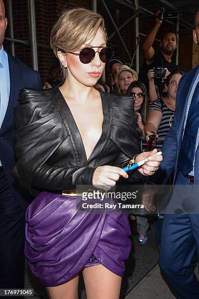 Singer Lady Gaga leaves the Z100 Studios on August 19, 2013 in New York City.